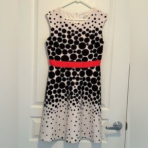 Black polka dots and white dress